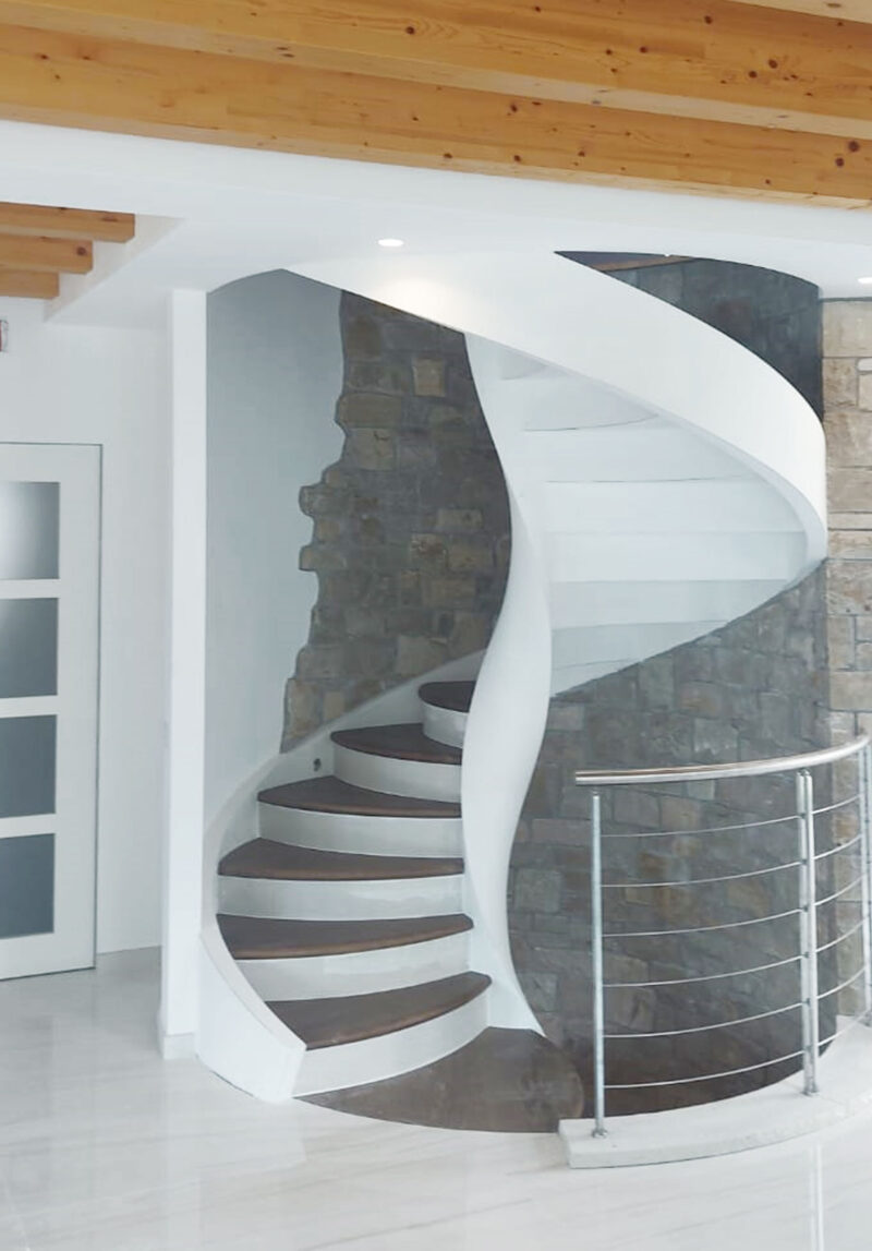 Custom-designed helical staircase with step change and spot-lights